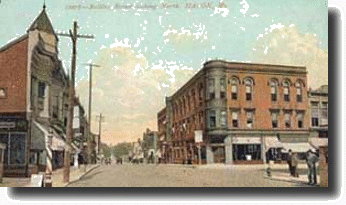 Historical image of street with a building on each corner